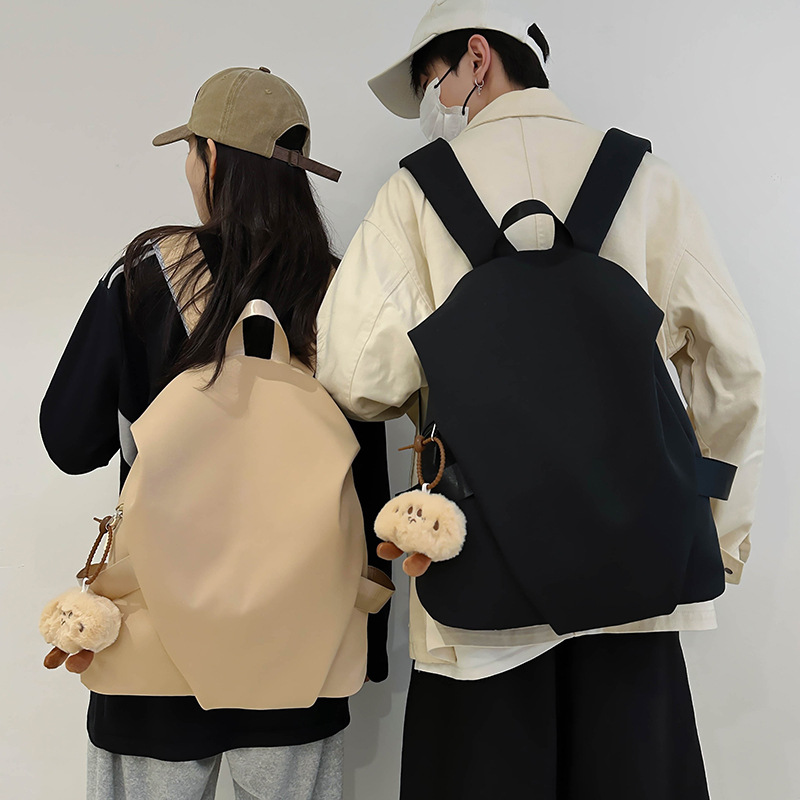 Men's large-capacity travel backpack, women's casual Japanese-style school bags for junior high school, senior high school and college students, versatile computer bags, trendy full figure