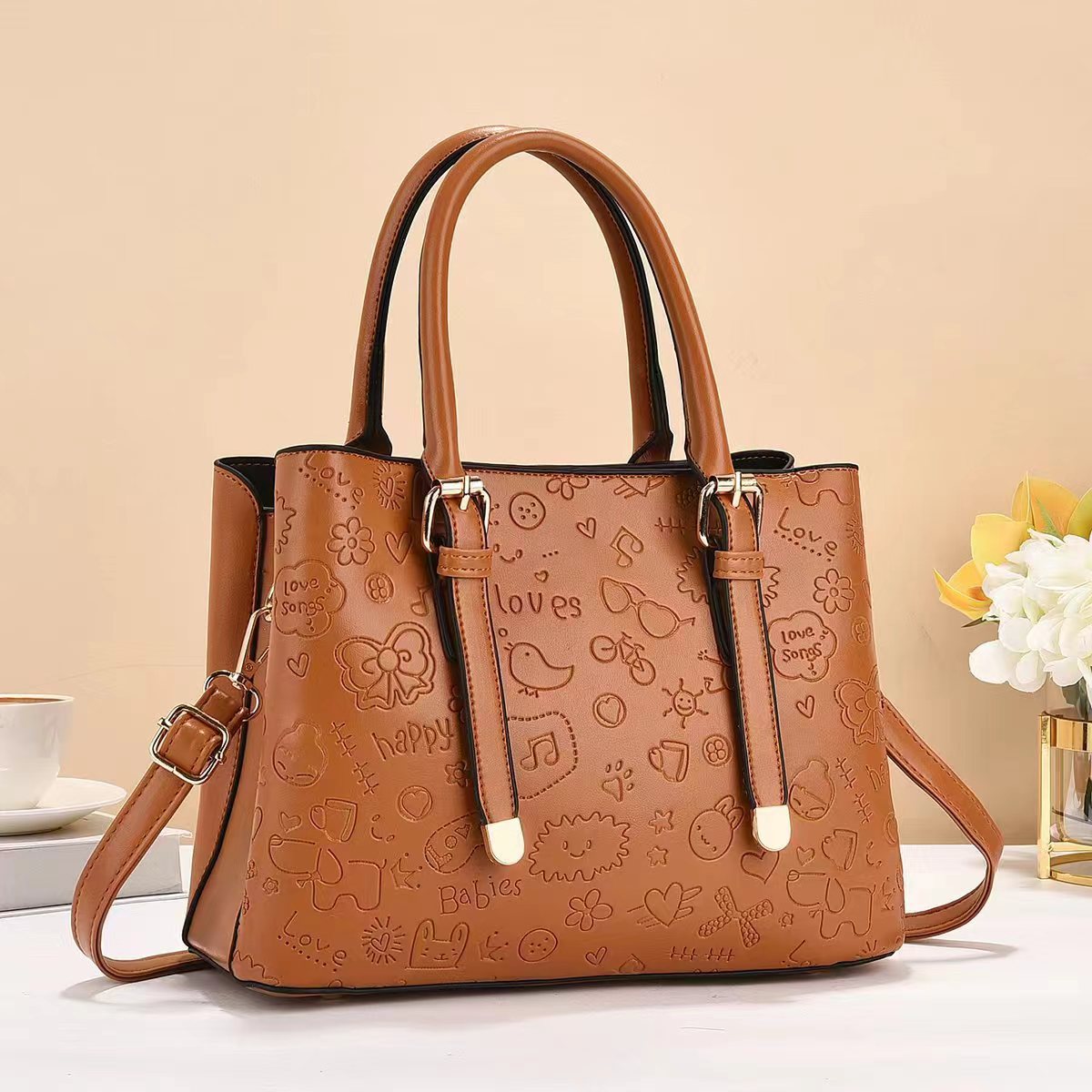 The manufacturer's export bag for women, 2024 new embossed graffiti handbag, Korean-style texture, single-shoulder crossbody bag, fashionable for women Application Scenario