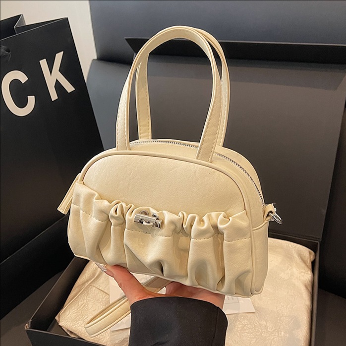 Korean style fashionable and individual pleated handbag for women 2025 new niche design single-shoulder bag, cool solid color crossbody bag full figure