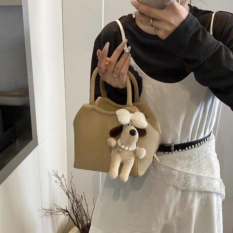 A high-end soft leather hand-held bucket bag for women, a new, niche, fashionable, simple and casual single-shoulder crossbody bag for commuting in 2025 Specification drawing