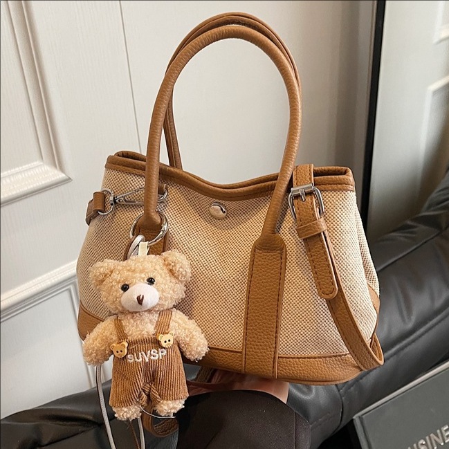 2025 New color-blocking canvas handbag, women's large-capacity commuter single-shoulder tote bag, casual and versatile crossbody bag full figure