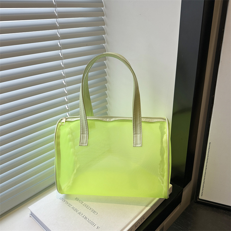 Transparent mesh handbag, a portable, versatile and large-capacity bag for women, is a cross-border trend full figure