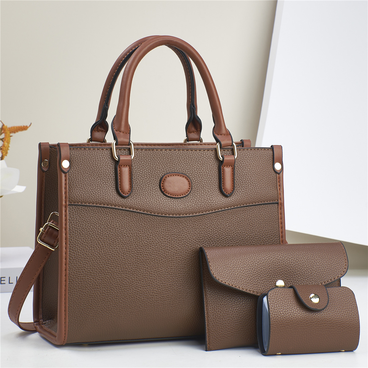 The new women's bag is a simple and elegant commuter style tote bag, a three-piece set of women's bags with a high-end feel, and a hand-held shoulder bag details Picture