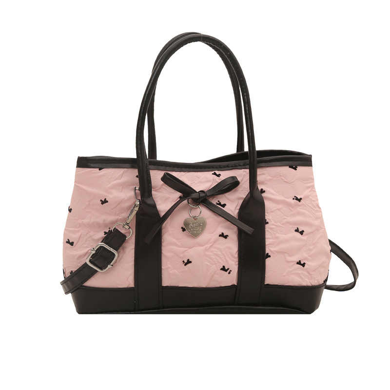 A new cross-border hand-held bucket bag for women in the summer of 2025, featuring a contrasting color combination and a simple texture. It is a single-shoulder crossbody bag Item Picture