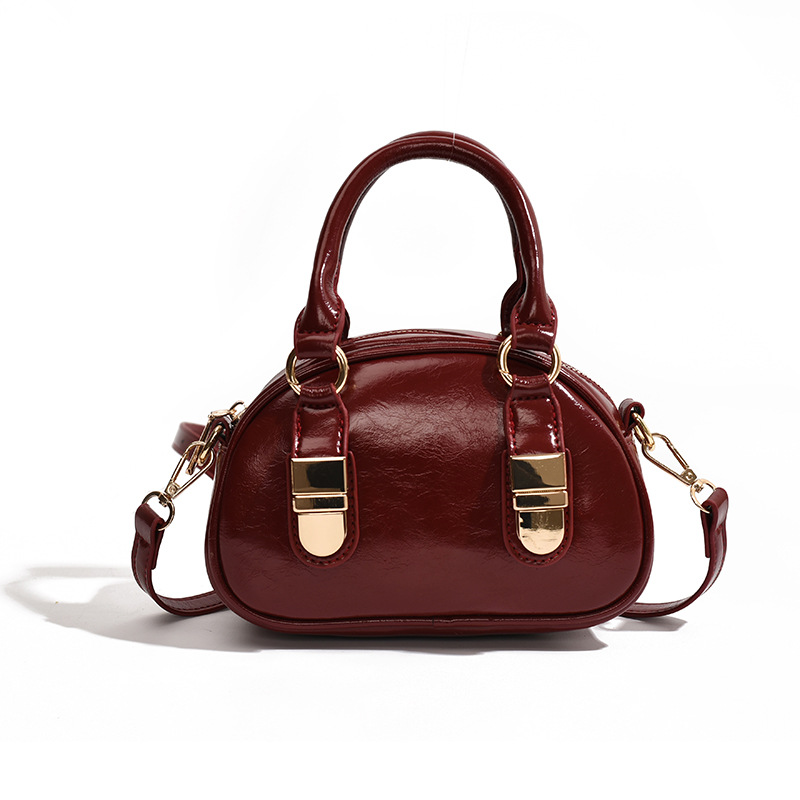 Korean niche hand-held bowling bag for women, 2024 new trendy and fashionable shell bag, versatile solid color crossbody bag Item Picture