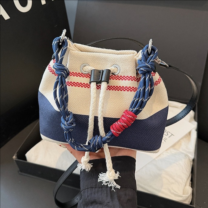 High-end handbag 2025 new striped canvas bag, trendy shoulder bag, striped underarm bag, commuter bucket bag full figure
