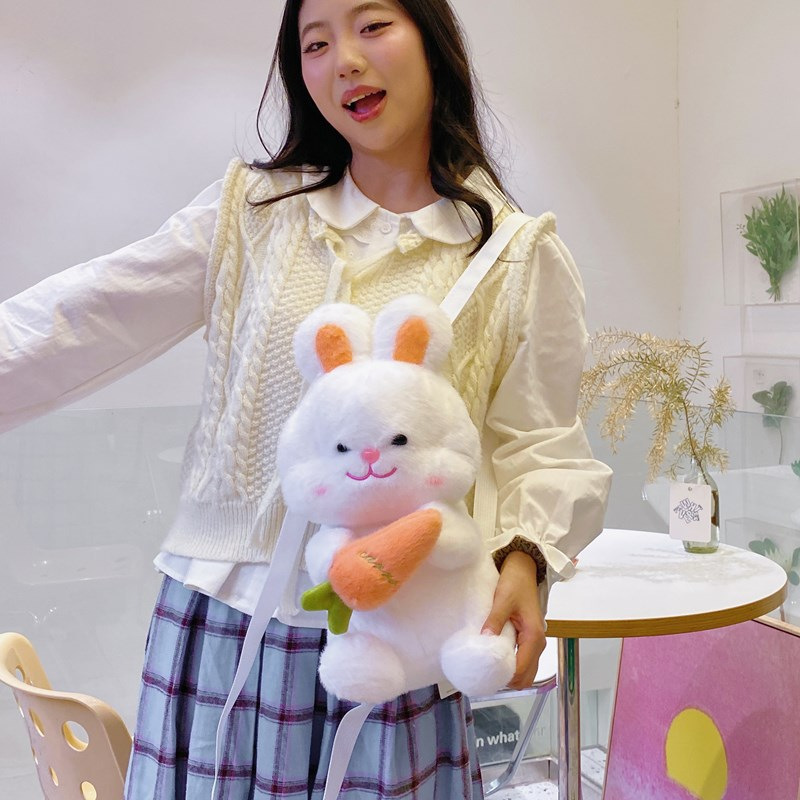 The new cute carrot and rabbit plush bag is a versatile mini backpack for autumn cartoon girls with a fluffy look details Picture