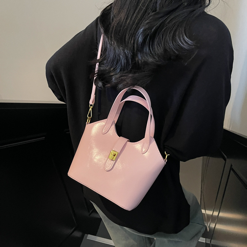 Korean pure color large-capacity hand-held bucket bag for women 2025 new style, versatile and simple crossbody bag, casual commuting single-shoulder bag details Picture
