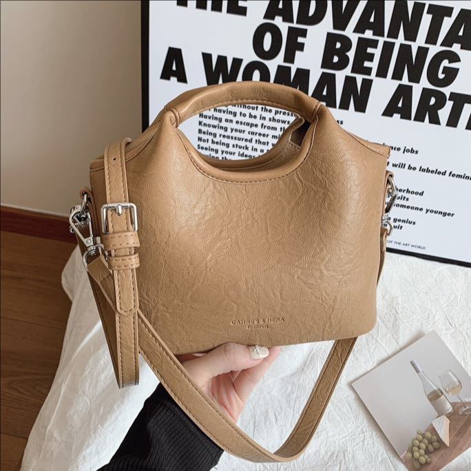 Korean trendy hand-held bucket bag for women, new Spring/Summer 2025, casual, versatile, stylish and high-end single-shoulder crossbody bag full figure