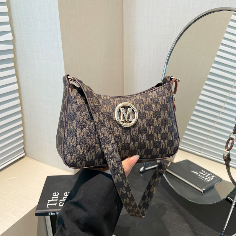 This is a trendy underarm bag with a unique and individualistic style. It's a fashionable small bag for women in 2025, featuring a slanted cross and a small square bag for women full figure