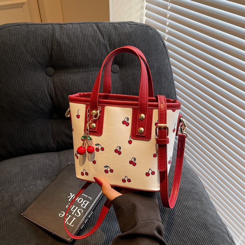 Cross-border 2025 New cherry hand-carry fashion bag, large capacity, cute commuting single-shoulder bucket bag full figure