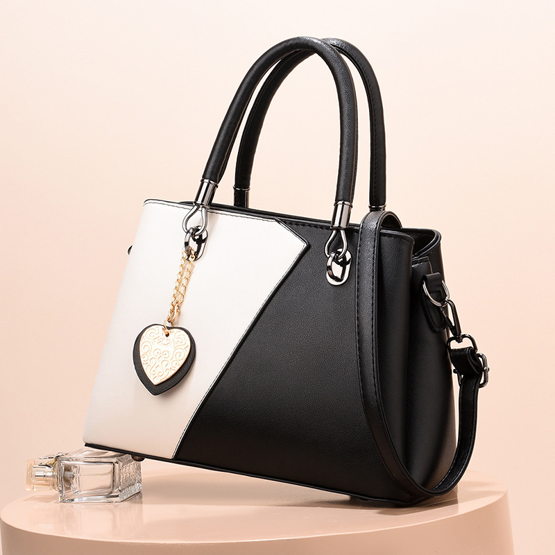 The 2022 new style of women's bags: simple and casual. Mom's bag, elegant lady's handbag. Korean-style color-blocking single-shoulder crossbody bag. Trendy details Picture