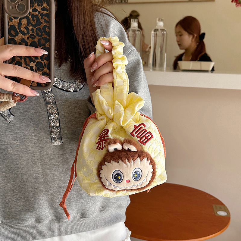 New cartoon canvas hand-held handbag with high appearance level, design sense, tight opening, large capacity, cute and girlish for travel Application Scenario