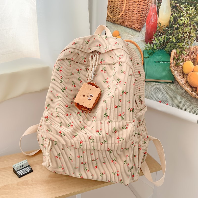 Japanese-style ins small flower schoolbag for girls, junior high school and senior high school students, corduroy design sense, unique and versatile backpack for girls full figure