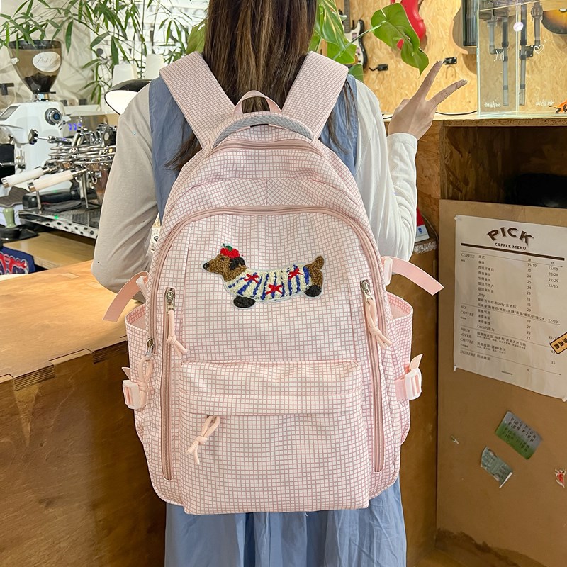 Schoolbag for female college students, a niche design backpack, a large capacity backpack with a checkered cartoon puppy for junior and senior high school students details Picture