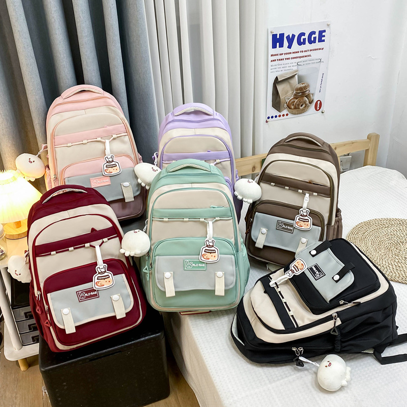 Wholesale of high school and junior high school students' schoolbags with high appearance level, color-matching to reduce burden, versatile, large-capacity backpacks, and cute girls' backpacks Application Scenario