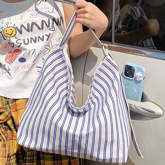 A new outdoor casual bag for fresh spring and summer, with a large capacity, color-blocking vertical stripes, and a light and simple underarm single-shoulder design for women details Picture