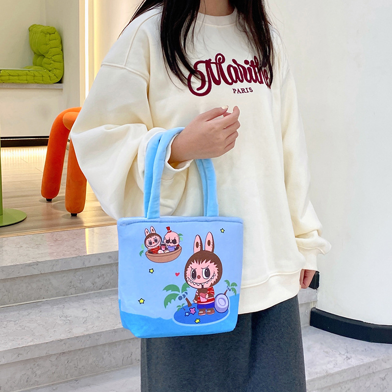 A new cartoon multi-pattern printed handbag with a Japanese girl's heart, a hand-held storage bag with a zipper details Picture