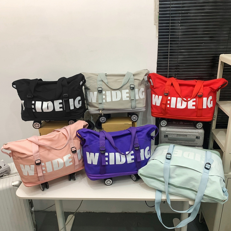 Multi-layer expansion swivel wheel travel bag, fashionable letter fitness bag for men and women, large-capacity lightweight long and short distance storage bag Application Scenario