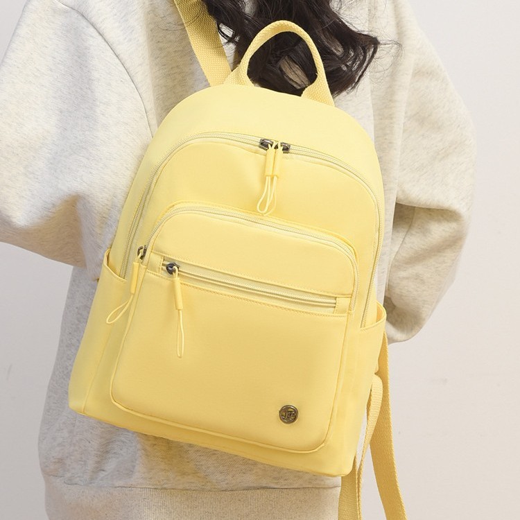 Fashionable and casual small backpack travel bag, trendy and versatile, water-resistant nylon fabric bag, simple and elegant backpack for women to go out Application Scenario