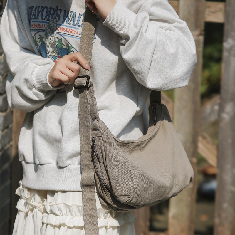 Canvas dumpling bag 2024 New style ins single-shoulder bag for women, laid-back casual crossbody bag, solid color retro small backpack details Picture