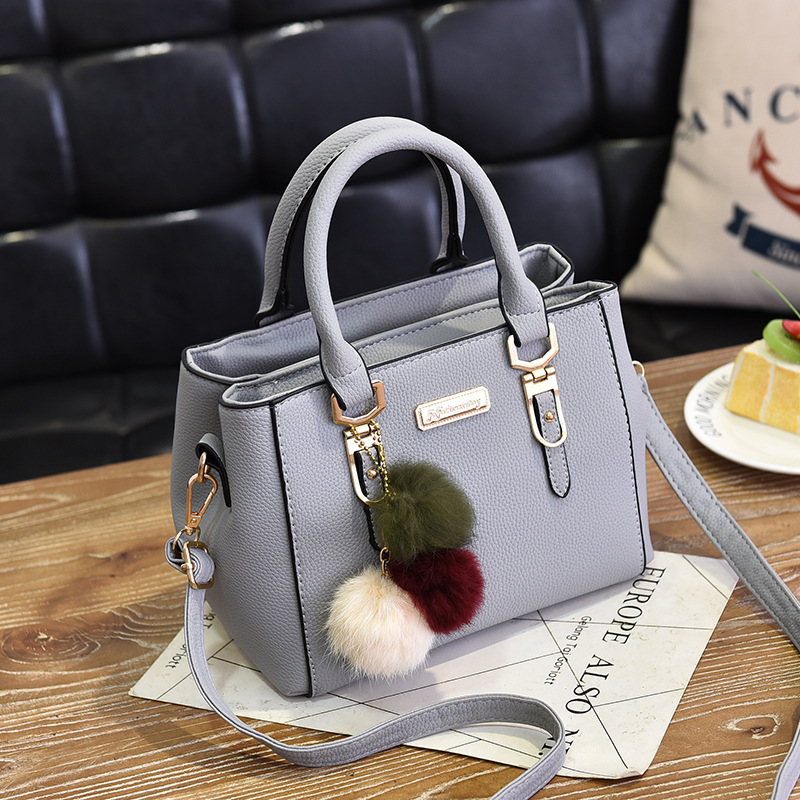 Bag Girl 2022 New European and American fashionable single-shoulder small bag Double-layer large capacity pom-ball hand-held crossbody women's bag consignment Application Scenario