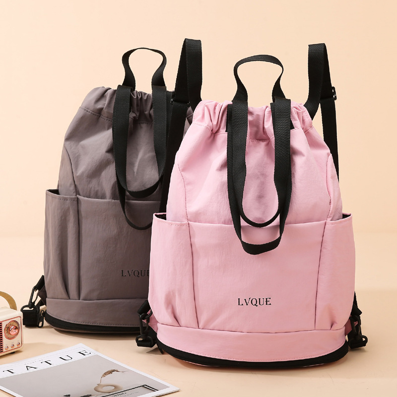 The new multi-functional portable drawstring storage bag is fashionable, simple and versatile. It is a fitness bag and a lightweight, large-capacity travel backpack full figure