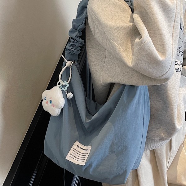 A new cream candy-colored single-shoulder canvas bag for spring and summer, with a large-capacity handbag, mommy bag and underarm bag full figure