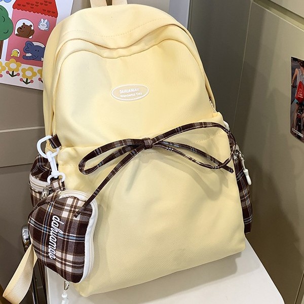 2024 New large-capacity schoolbag, niche design, student lightweight backpack, bow, casual storage backpack full figure