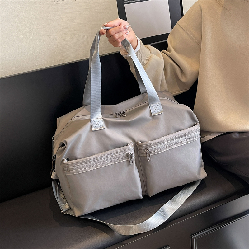 Cross-border wholesale travel bags for both men and women, sports, swimming and fitness bags, large-capacity carry-on luggage bags for going out full figure