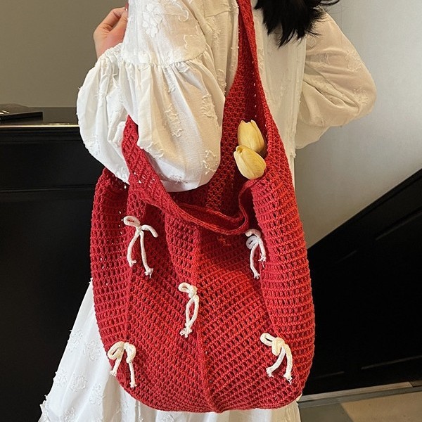 Fashionable bow hollowed-out woven bag, mesh bag for women, large-capacity single-shoulder vacation beach bag, lightweight fabric commuting bag full figure