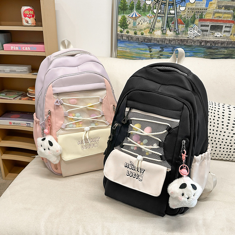A cute and fresh color-blocking backpack for young girls, a Korean version of a backpack for junior and senior high school campuses, and a new lightweight schoolbag for primary school students full figure