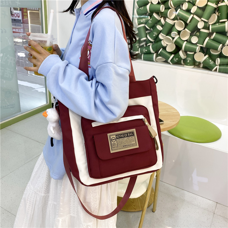 New large-capacity canvas bag for after-school tutoring, dual-purpose handbag, girls' schoolbag, canvas crossbody bag for junior high school and senior high school students Application Scenario