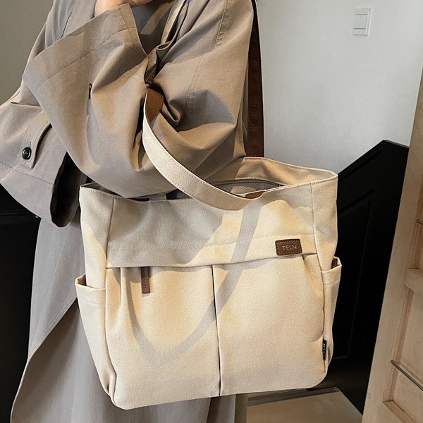 A new best-selling, niche, casual and simple style large-capacity solid-color fabric bag, a versatile single-shoulder women's bag for students' commuting to class Specification drawing