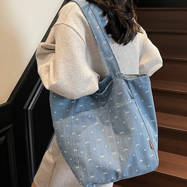 Fresh embroidered bow tote bag, fashionable girl's hand-held vest bag, large-capacity shopping bag, denim single-shoulder bag Application Scenario