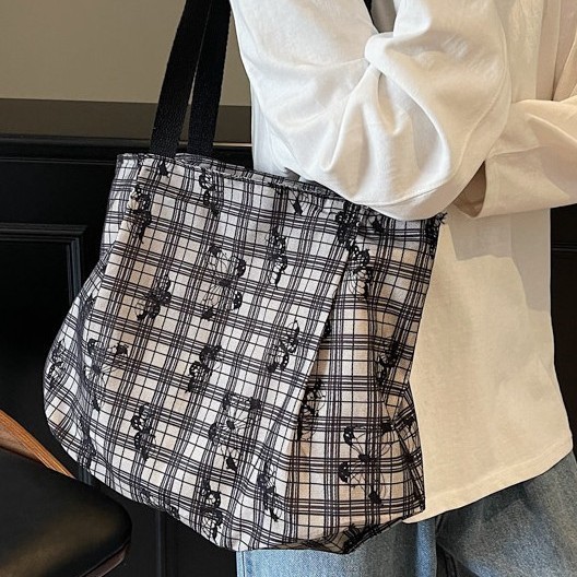 A new Korean floral bucket bag for women, a versatile single-shoulder bag for commuting and a artistic large-capacity tote bag for women details Picture