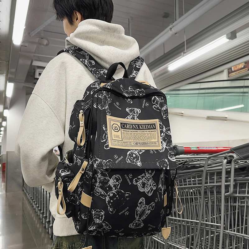 A simple printed bear large-capacity backpack for junior high school girls, a new trendy couple computer bag for college students full figure