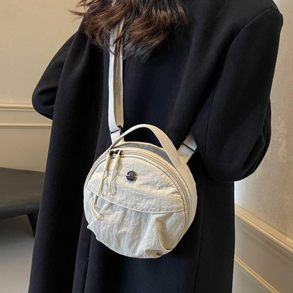 The new 2024 round pancake bag is a versatile mobile phone, a lightweight bag, a women's versatile commuting bag, and a crossbody single-shoulder bag for travel full figure