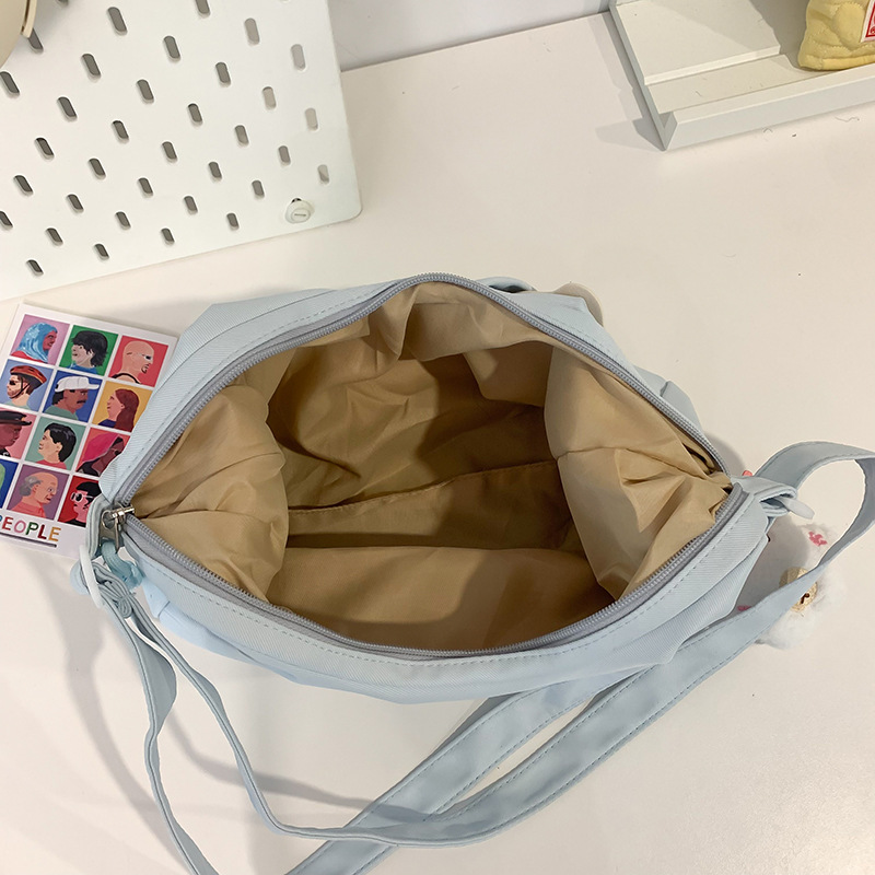 This Japanese-style cartoon panda single-shoulder bag is simple and versatile for women, a lightweight crossbody bag, a women's underarm bag, and a commuting bag Application Scenario