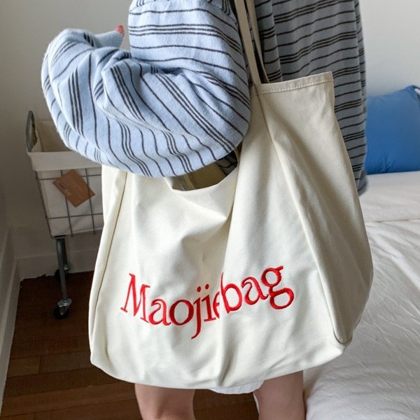 The 2025 summer new letter niche design Korean-style canvas bag is a large-capacity commuting casual hand-held cloth bag for women Specification drawing