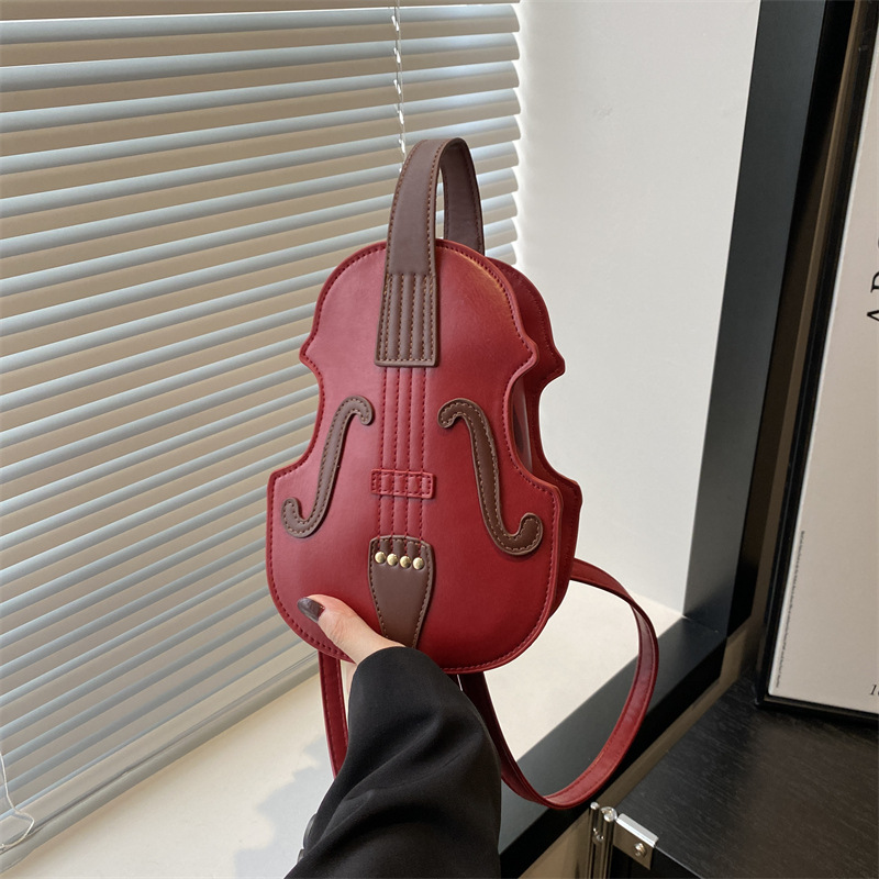 202 Autumn New style organ guitar crossbody bag, European and American violin retro backpack, color-blocking and patchwork commuting bag full figure