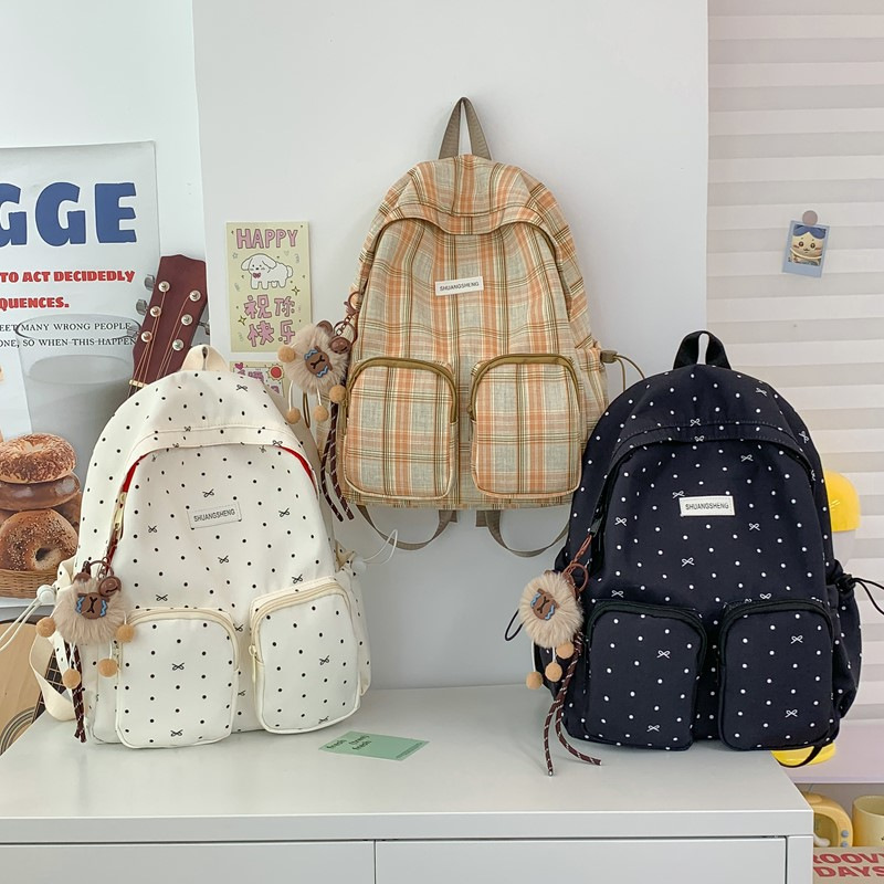 A new style of forest-themed backpack for college students, a sweet and cute polka dot backpack with large pockets and versatile versatility Application Scenario