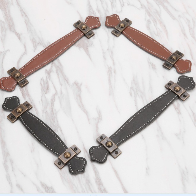 Leather handles, leather luggage handles, drawer and cabinet door handles, brownish black leather handles, luggage handles details Picture