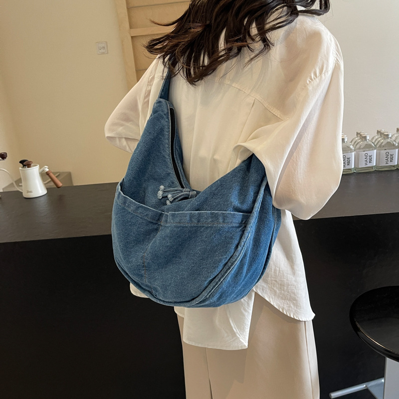 A Korean-style ins high-end casual denim bag for women, featuring a simple and laid-back style for daily commuting and shopping full figure