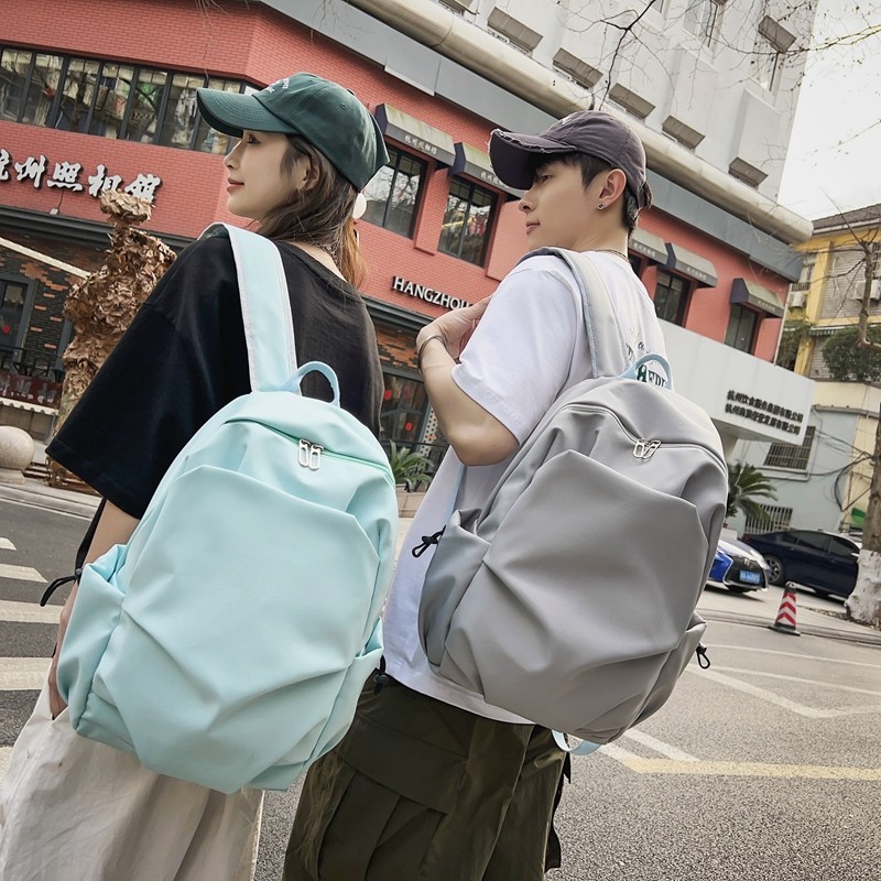Multi-functional solid-color casual backpack for male and female college students, simple large-capacity backpack, laptop bag full figure