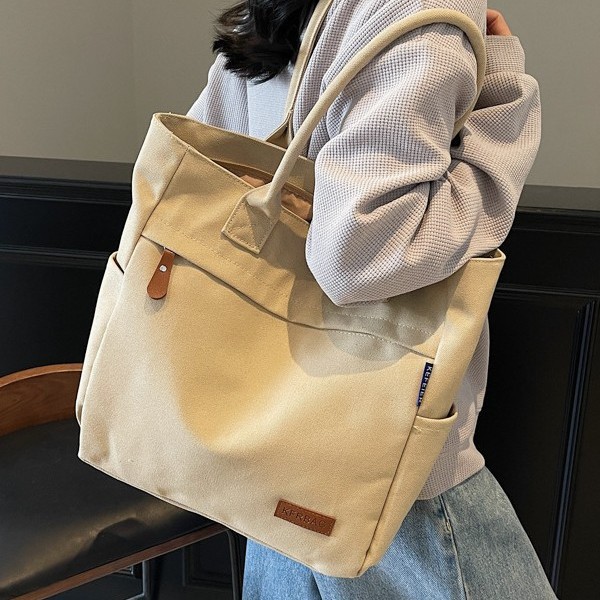 Spring and summer women's versatile tote bags, large-capacity canvas bags, solid-color design hand-held shoulder bags, trendy Application Scenario