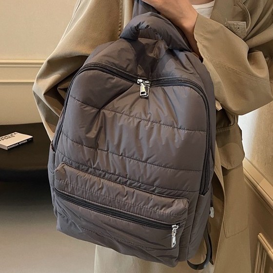 New large-capacity cotton jacket backpacks for autumn and winter, niche commuting travel bags, fashionable and versatile, personalized casual schoolbags full figure