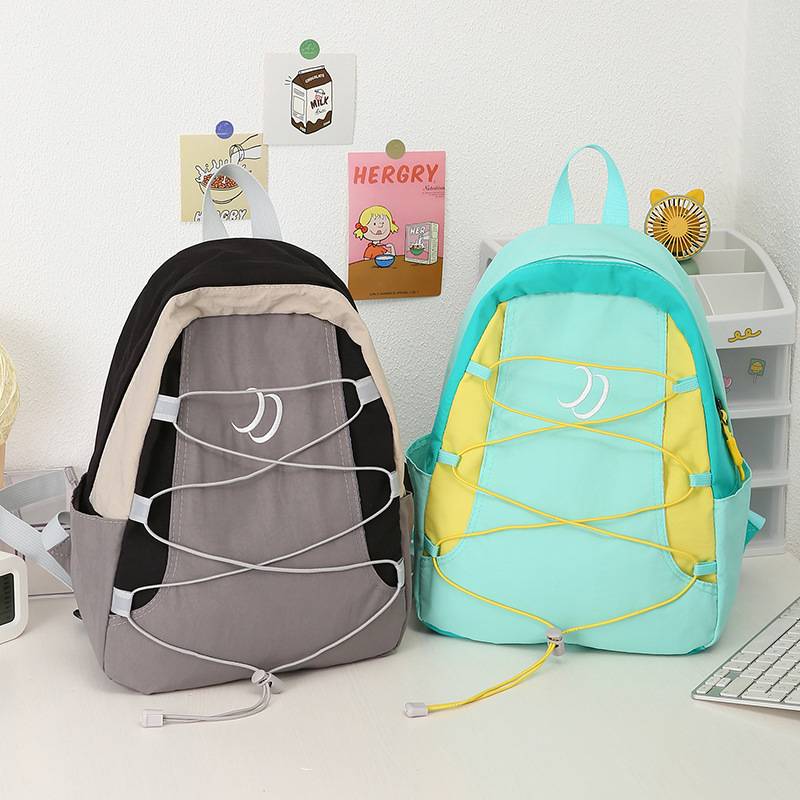 Cross-border casual lightweight backpack, new Korean version, simple outdoor backpack, waterproof nylon schoolbag, primary school students' travel full figure
