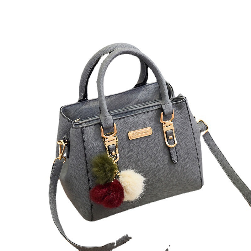 Bag Girl 2022 New European and American fashionable single-shoulder small bag Double-layer large capacity pom-ball hand-held crossbody women's bag consignment Item Picture