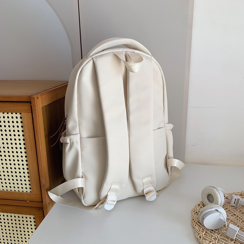 Japanese-style simple schoolbag for female college students, high appearance level computer backpack for junior and senior high school students, travel light backpack for male students Application Scenario